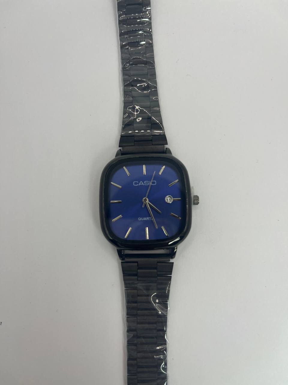 CASIO QUARTZ noir tableau bleu