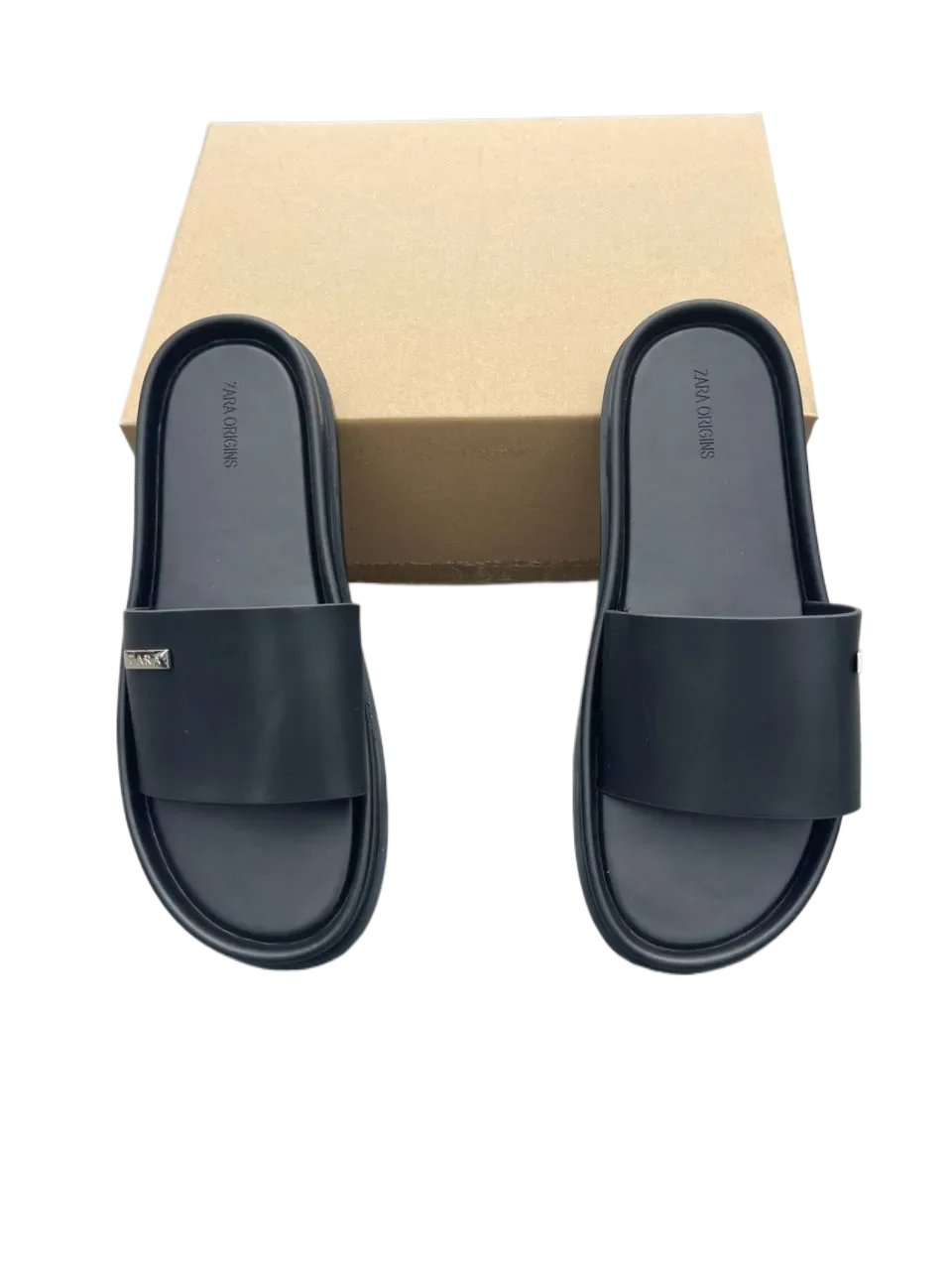 Mules slides homme noires — confortables, minimalistes et faciles à enfiler.