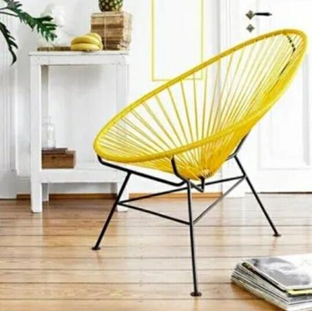 Le fauteuil rond en résine de rotin est une chaise confortable