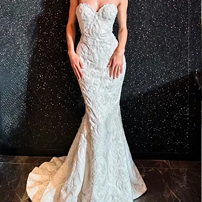A strapless Lace Mermaid Gown