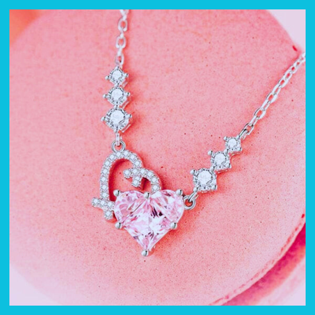 Collier double cœurs à pierre rosé