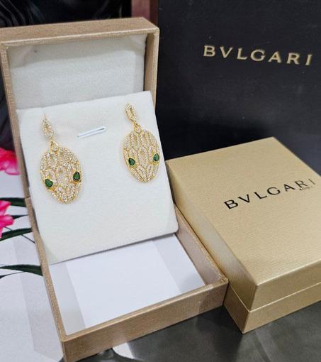 Bvlgari boucle d’oreilles acier doré avec packaging bvlgari