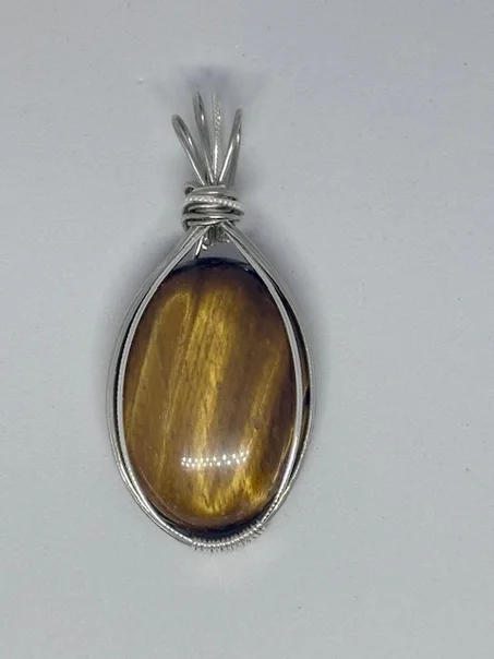 Pendentif en Œil de Tigre – Protection et élégance naturelle