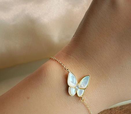 Gourmette Van cleef papillon en acier inoxydable