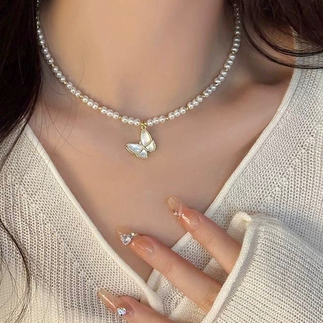 Collier papillon avec perles en acier inoxydable