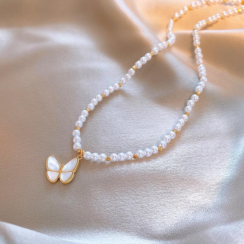 Collier papillon avec perles en acier inoxydable