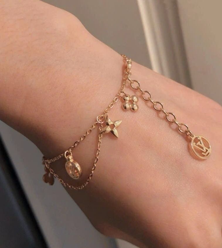 Gourmette Louis Vuitton doré en acier inoxydable