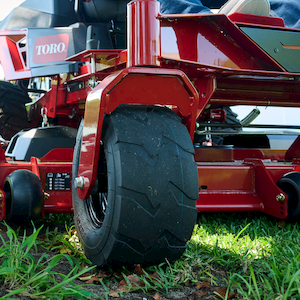 Close up image of the front caster tire with tread
