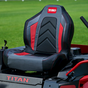 Close up image of the seat on the Titan Mower - seat is black with red side stripes