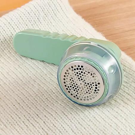 ألة إزالة الوبر من الملابس