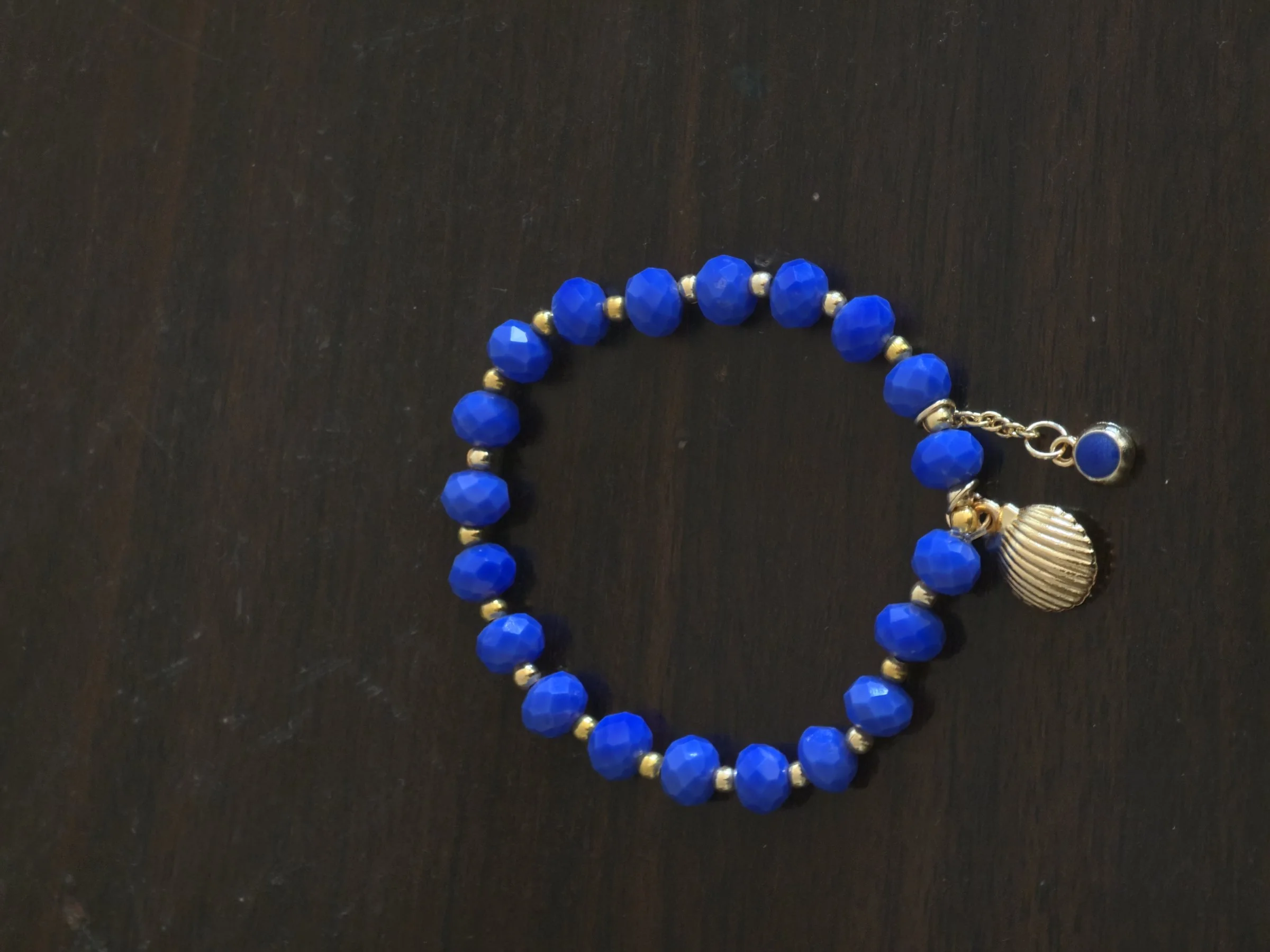 Three shell bracelets, the sea
