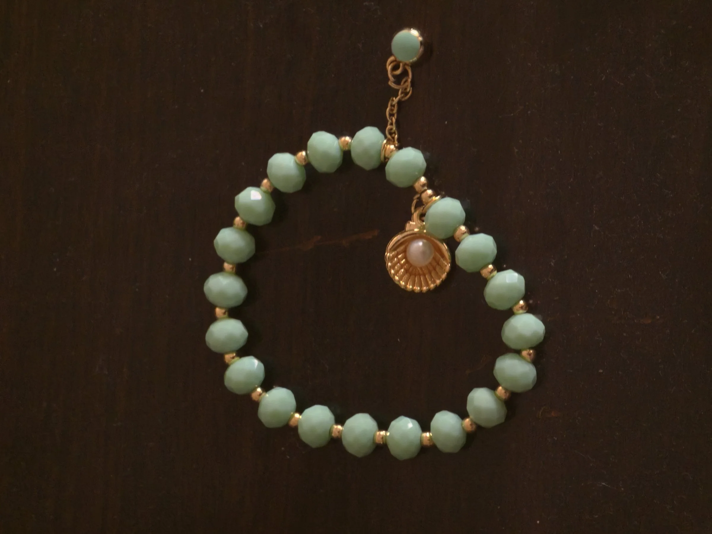 Three shell bracelets, the garden